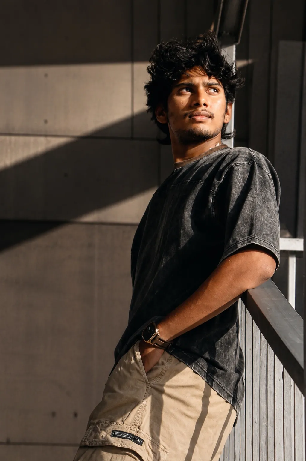 The ORIGIN tee, leaning on a concrete railing